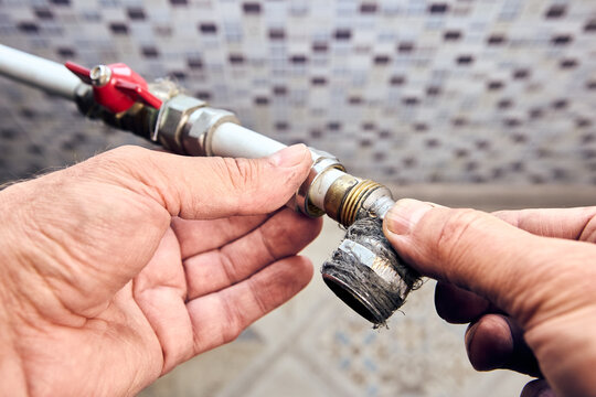 Crimp collet compression fitting angle with transition to an external thread in hands of plumber that eliminates leaks.