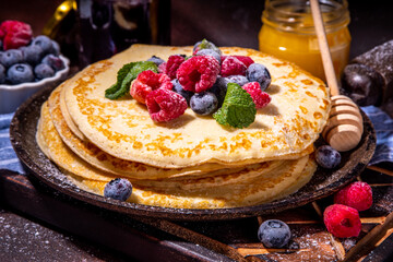Crepes pancakes with berry