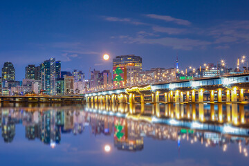 Naklejka premium Seoul City at night with Full moon South Korea