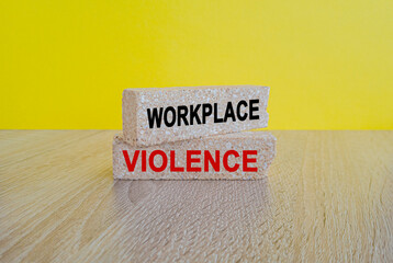 WORKPLACE VIOLENCE symbol. Concept words WORKPLACE VIOLENCE on brick blocks. Beautiful yellow...
