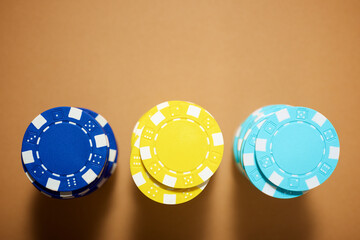 Casino chips on a brown surface