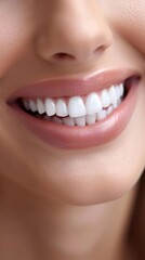 Obraz premium A closeup of a womans smile with perfectly white teeth, set against a soft, blurred background
