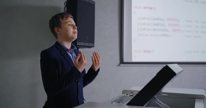 Genius Schoolboy In Classic Jacket Speaking In Classroom, Presenting Computer Science Project