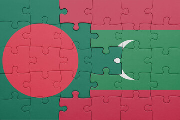 puzzle with the colourful national flag of bangladesh and flag of maldives .