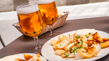 Grilled Cuttlefish Typical Spanish Tapa and Beers at Restaurant Bar, Spain, Europe