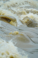 Powerful River Rapids Flowing Nature Water Dynamics Stock Photo, Dynamic River Waves and Turbulence Natural Waterforce, Swirling River Currents and Waves Energetic Water Motion.