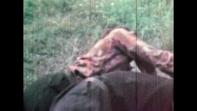 Enemy killing opponent with knife in fist fight. Cinematic death. Two men in dramatic fight outdoor. Close up, tension struggle. Brutal attack. Man stabbing repeatedly. Vintage film. Retro archive