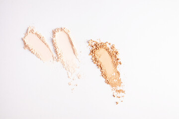 Three different cosmetic loose powder strokes on white background for mockup, design, advertising powder texture. space for text. texture samples.