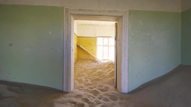 Kolmanskop, The abandoned houses. the famous tourist attraction in Namibia, South Africa. Empty sand dune in home room . The ghost town.