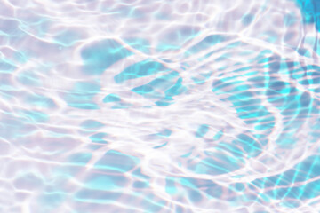 Blue water with ripples on the surface. Defocus blurred transparent blue colored clear calm water surface texture with splashes and bubbles. Water waves with shining pattern texture background.