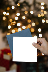 Obraz premium Hand holding Christmas card transparent png