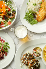 Various tasty dishes served on the restaurant table stock photo