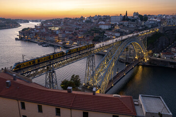 Naklejka premium Porto city view from the bridge at sunset