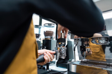 Barista Preparing Fresh Espresso in a Modern Coffee Shop with Professional Espresso Machine