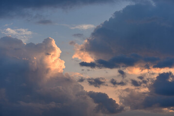 Evening cumulus clouds in the light of the sun.