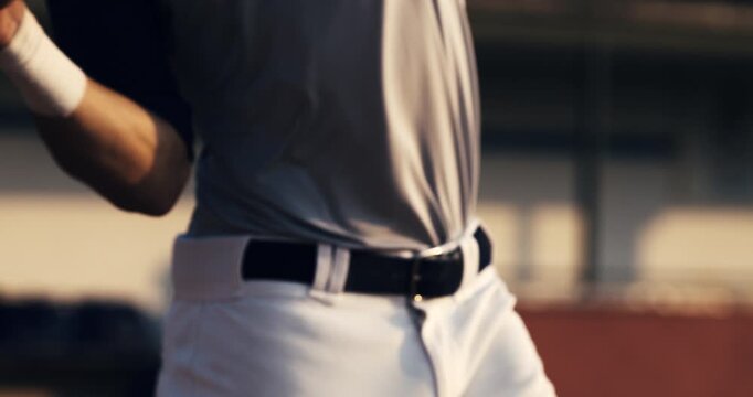 Super slow motion macro of baseball player batter hitting baseball ball with bat during competition game match on baseball stadium at 1000 fps.