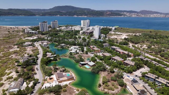 Aerial view of Troia Peninsula, Setubal, Portugal with Arrabida Mountains in background and Setubal on the far right