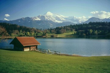 Naklejka premium Landscape with an old village house standing in a field with autumn-yellowed grasses against a cloudy sky. Rural area.. Beautiful simple AI generated image in 4K, unique.