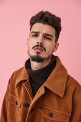 Obraz premium Man in trendy clothing looking thoughtful.