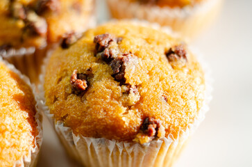 A close up of a muffin with chocolate chips on top