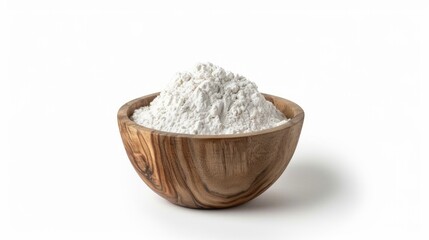 A natural wooden bowl containing fine white flour, suitable for baking or cooking.