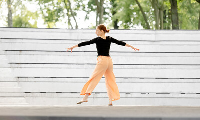 Beautiful Girl Dances Contemporary Dance On Amphitheater Stage