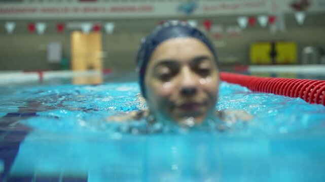 Paralympic swimmer prepares for Paris 2024 Paralympic Games. Amputee Athletes.