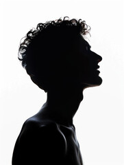 Silhouette of a man with curly hair