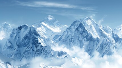 A breathtaking view of snowy mountain peaks under a clear blue sky, with clouds hovering below the majestic summits.