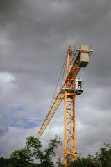 A bustling construction site showcases cranes, scaffolding, and formwork, with workers actively building a new skyscraper. This scene captures the dynamic intersection of engineering, architecture, an