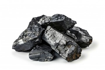 A stack of black coal on a clean white surface, ready for use or storage