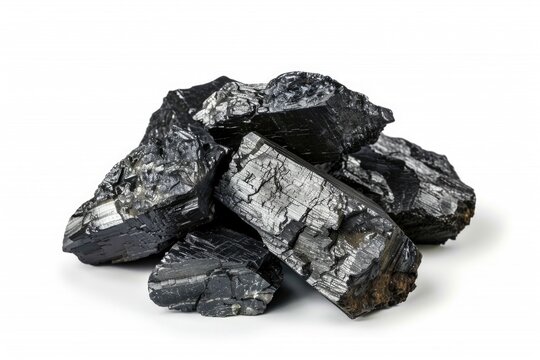 A stack of black coal on a clean white surface, ready for use or storage