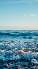 Blue water with whitecaps crashes on the shore