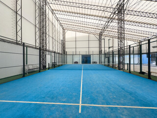 Padel court with lines and net indoor