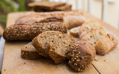 Fresh loaf of bread on wooden board
