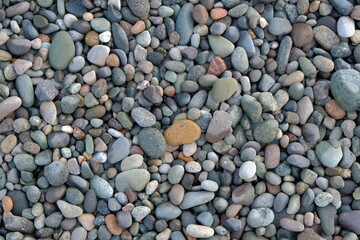 stones background. natural background stones on the beach. multi-colored pebbles with rounded stones as a background