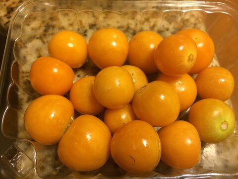 Fresh Pichuberries in a Plastic Container on the Counter