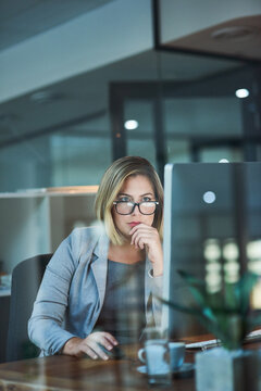Office, computer and business woman at night thinking for online project, planning and research report. Corporate, professional and person working late on PC for reading email, internet and website