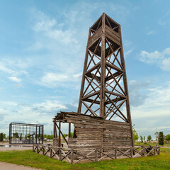 Worlds first industrially drilled oil well in Baku, Azerbaijan. The wooden structure stands tall against clear blue sky