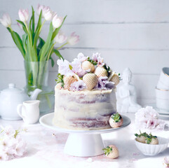 White cake with champagne strawberries