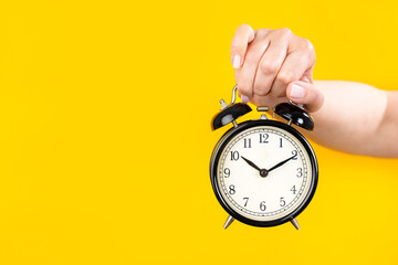 Hand with alarm clock