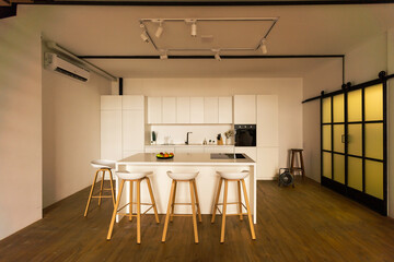 Gourmet kitchen features white shaker cabinets with marble countertops, stone subway tile backsplash, double door stainless steel refrigerator and gorgeous kitchen island.