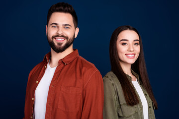Photo of cheerful lovely couple wife husband wear stylish clothes famiy outfit isolated on dark blue color background