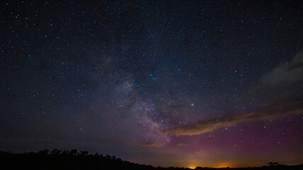 Naklejka premium Night Sky Filled with Vibrant, Colorful Stars