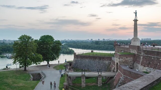 Day to night hyper lapse Pobednik (The Victor) monument in the Belgrade Fortress, Serbia