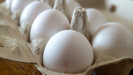 Chicken eggs in a tray. Chicken eggs from the store close-up