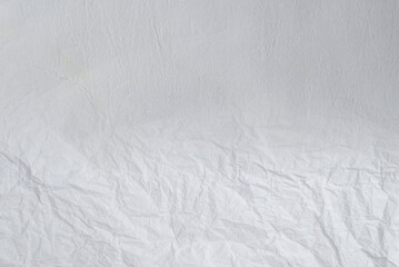 Crumpled white paper background.