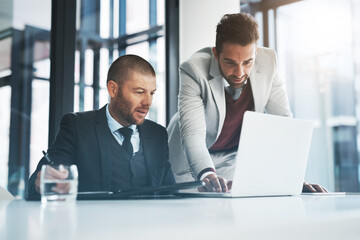 Businessmen, laptop and support for discussion in office, accounting agency and teamwork for...