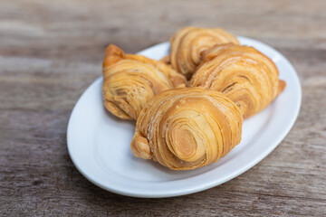 Curry puffs are a snack of Central in Thailand. It is a small pie that contains chicken and potatoes in a deep fried pastry shell.