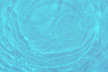 Blue water with ripples on the surface. Defocus blurred transparent blue colored clear calm water...